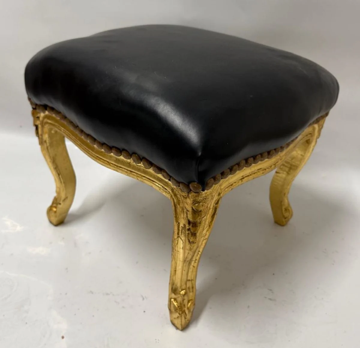 Baroque faux leather footstool black / antique gold H. 34 cm - baroque style stool